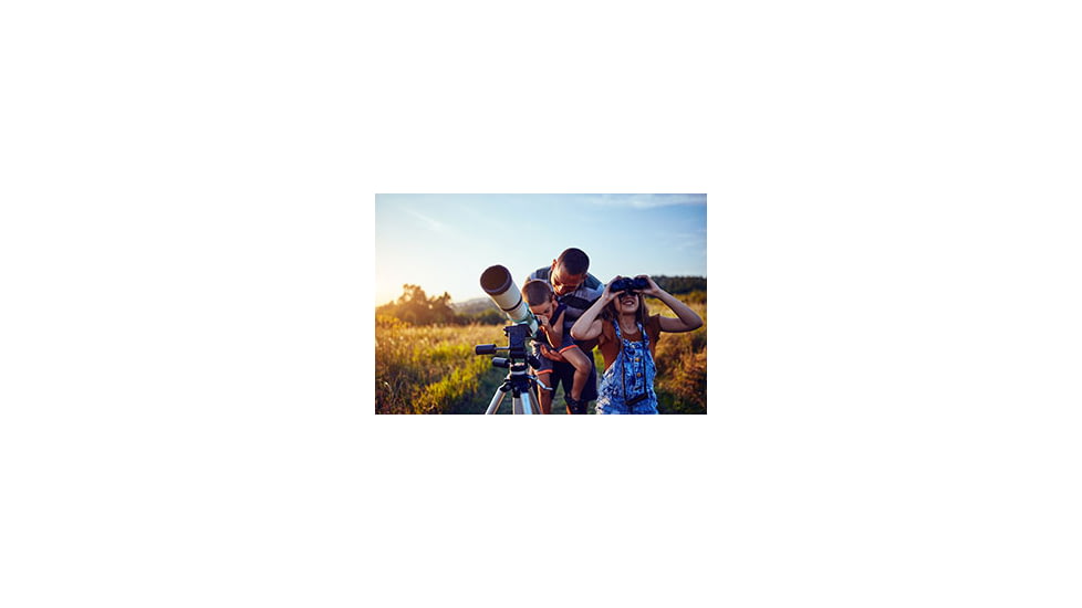 Father and Kids Looking at Night Sky with Telescope