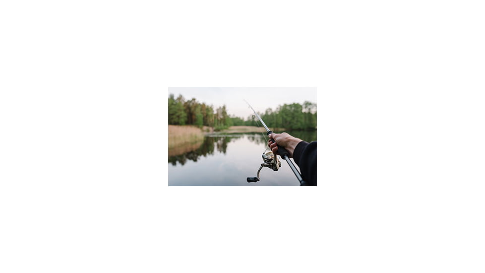 Fisherman with Spinning Reel on Fishing Rod